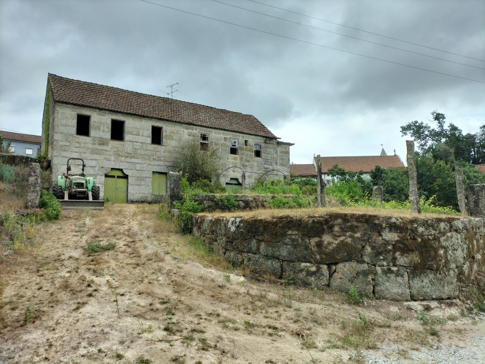 Photo of the existing late-19th-century stone building, as it stands today