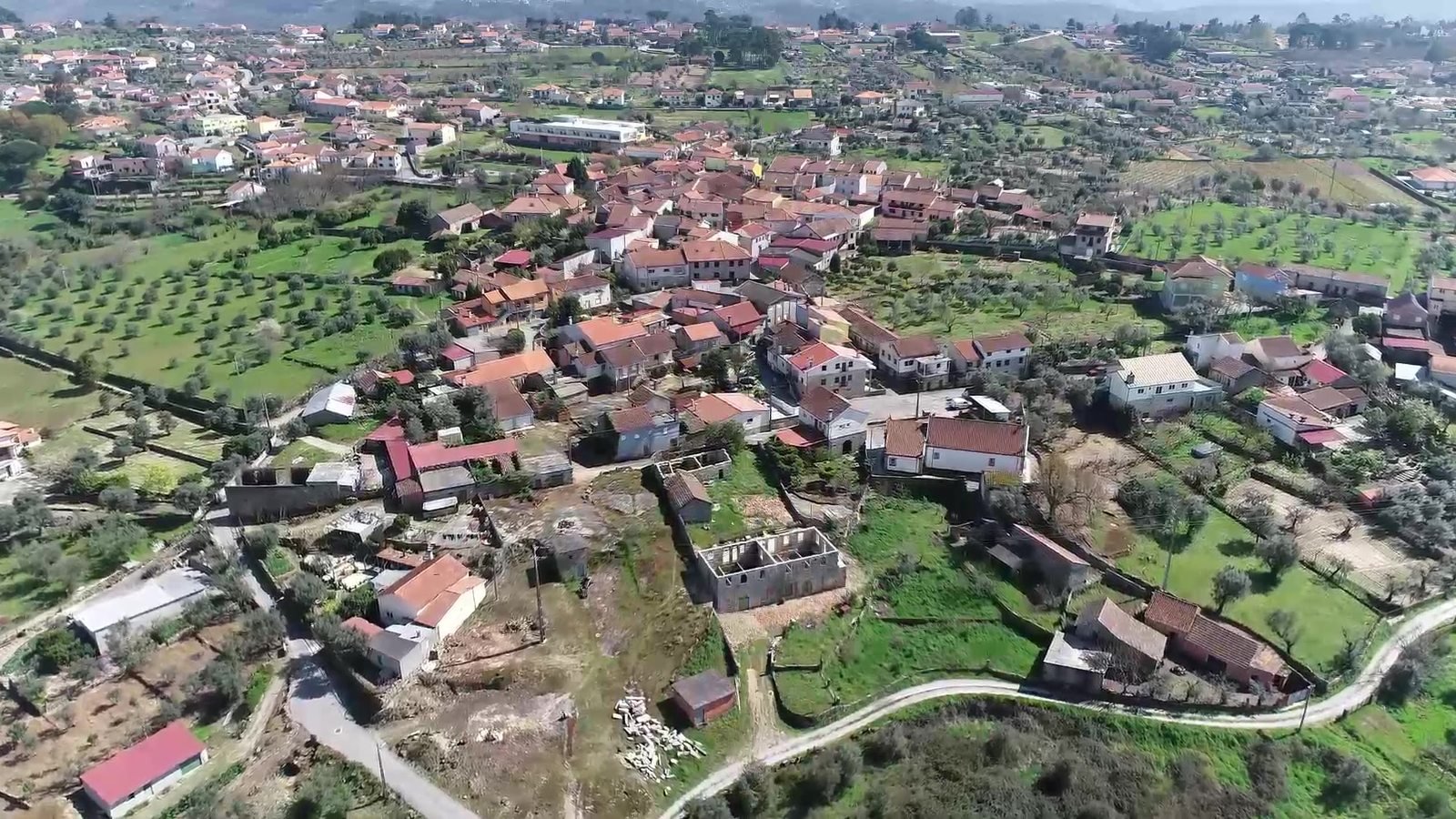 Aerial view of the property toward the mountains, April 2025