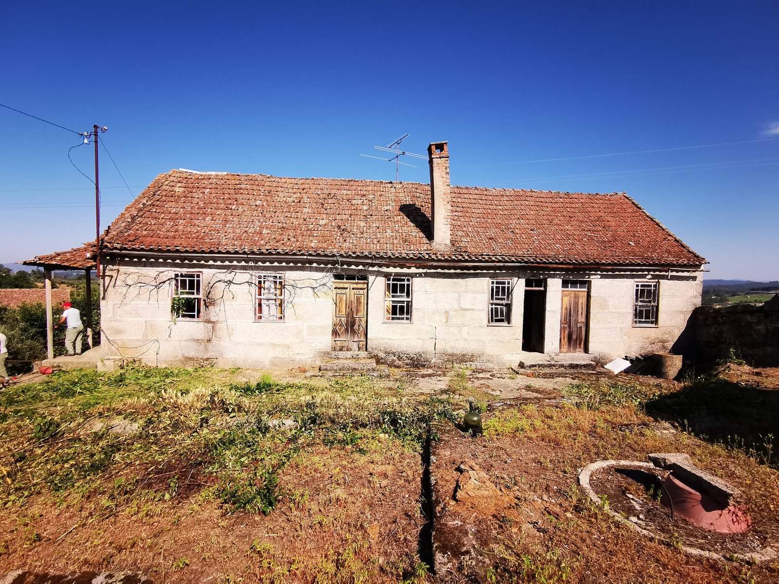 Ground-level photo of another stone building on the property